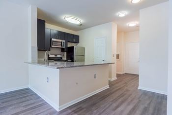 A kitchen area with a counter and cabinets.at Riverview Landing @ Valley Forge, Eagleville, PA 19403